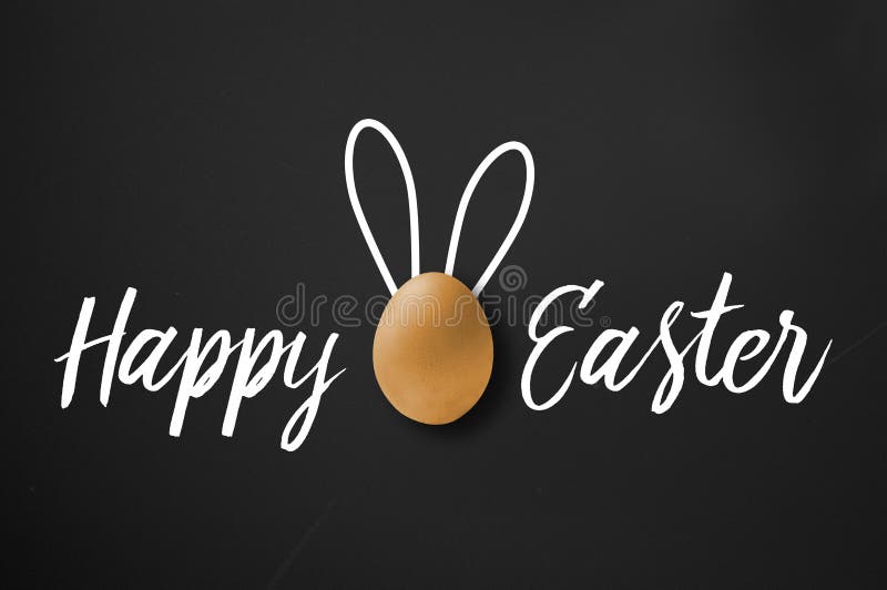 Happy easter greeting card on black chalkboard royalty free stock photography