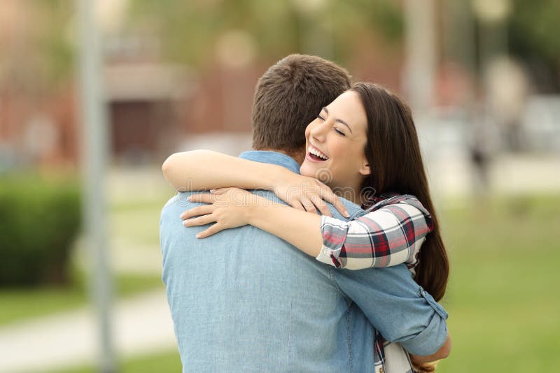 Happy encounter of two friends outdoors stock images Happy encounter of two friends outdoors stock images