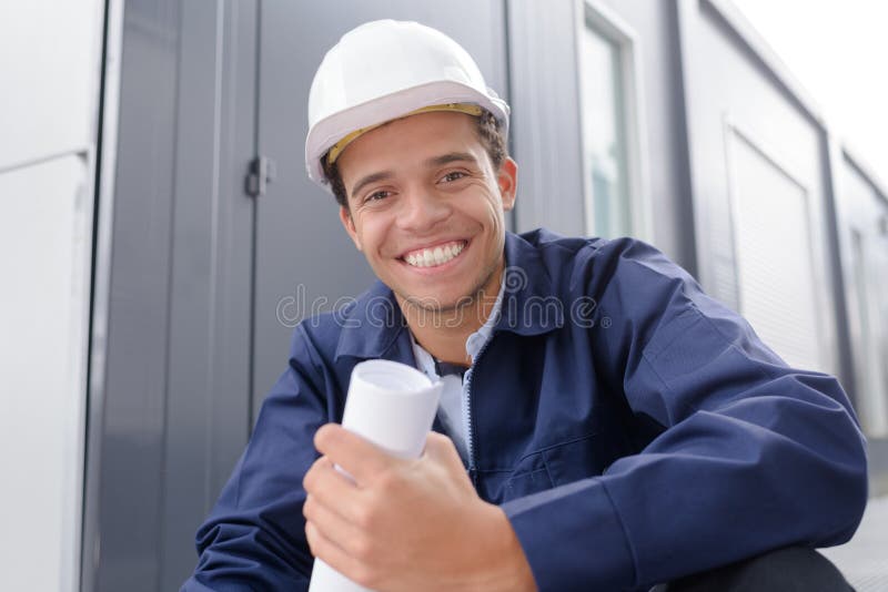 Happy engineer looking at camera stock photos