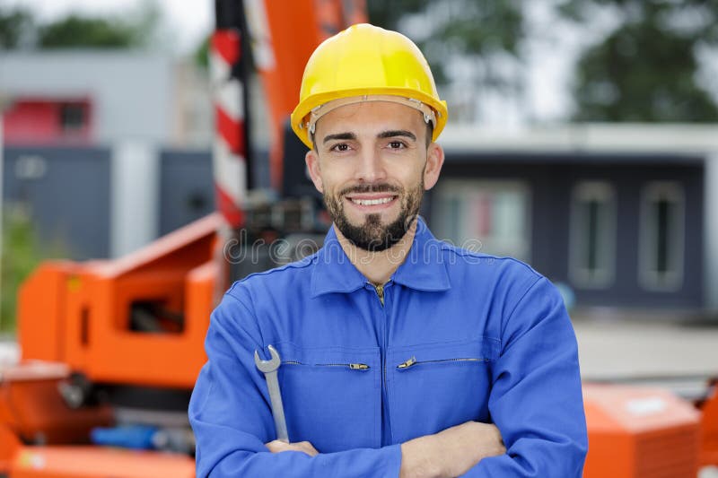 Happy engineer man looking at camera stock photography