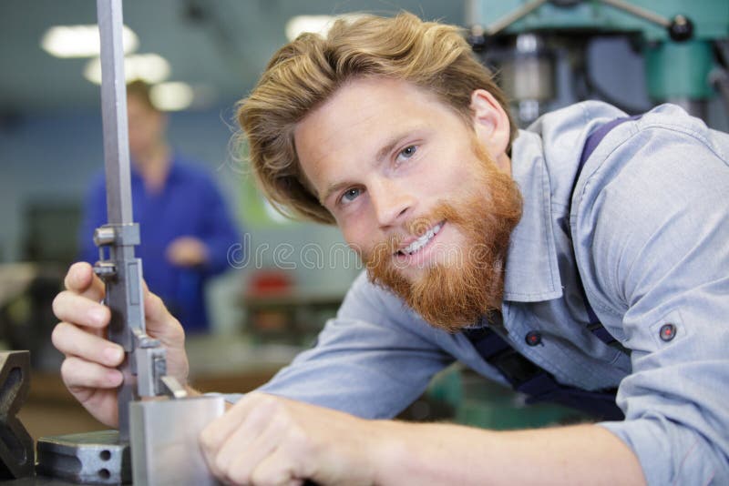 Happy engineer working in factory royalty free stock photography