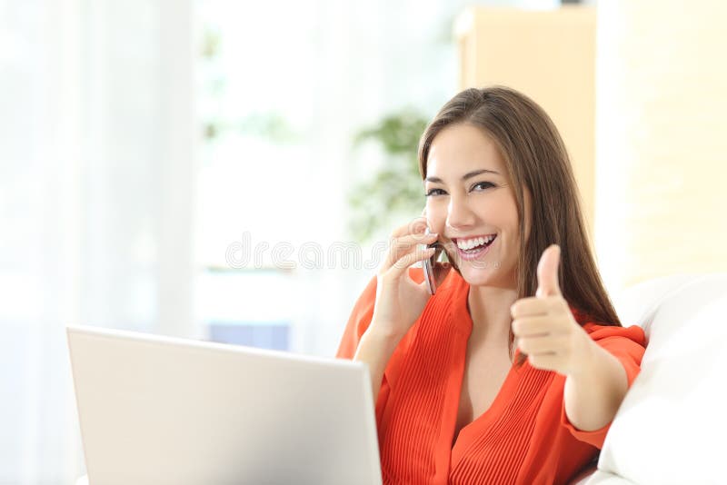 Happy entrepreneur working with thumbs up stock photography