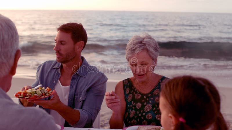 Happy extended family eating stock video Happy extended family eating stock video