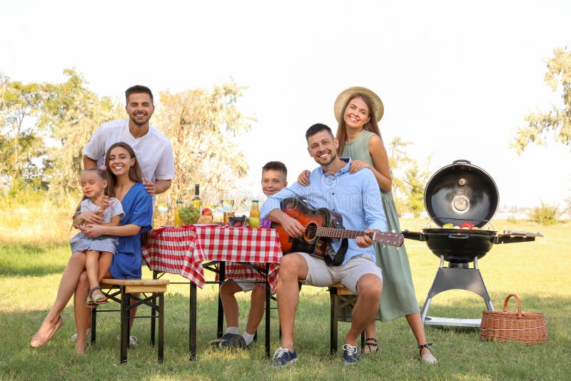 Happy families with little children having in park royalty free stock photos Happy families with little children having in park royalty free stock photos