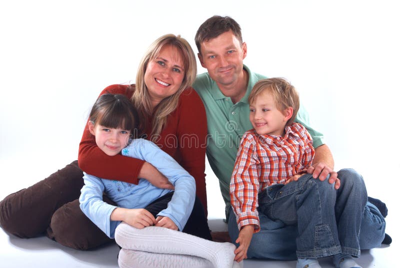 Isolated portrait of a smiling family of four, mother, father, son and daughter. Happy embracing couple stock images, royalty-free photos and pictures