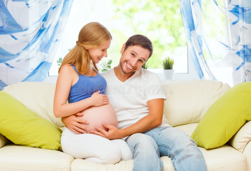 Happy family in anticipation of the birth of baby. Pregnant woma