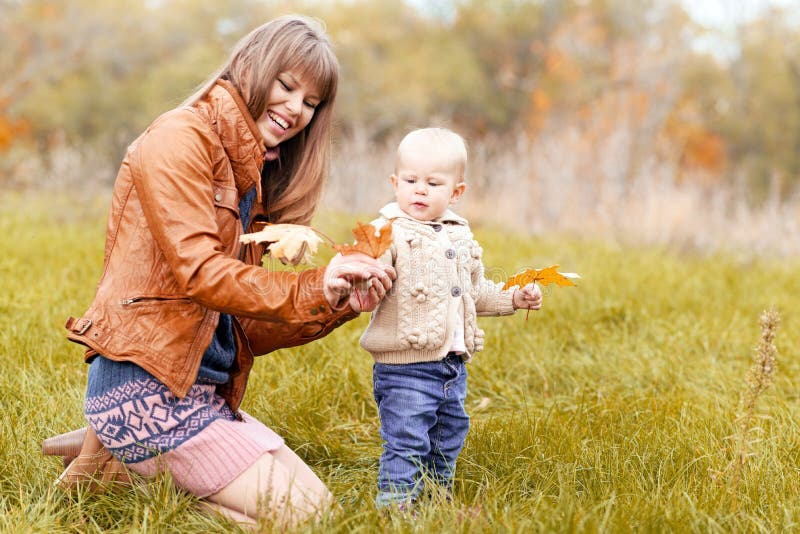 Happy family in autumn forest