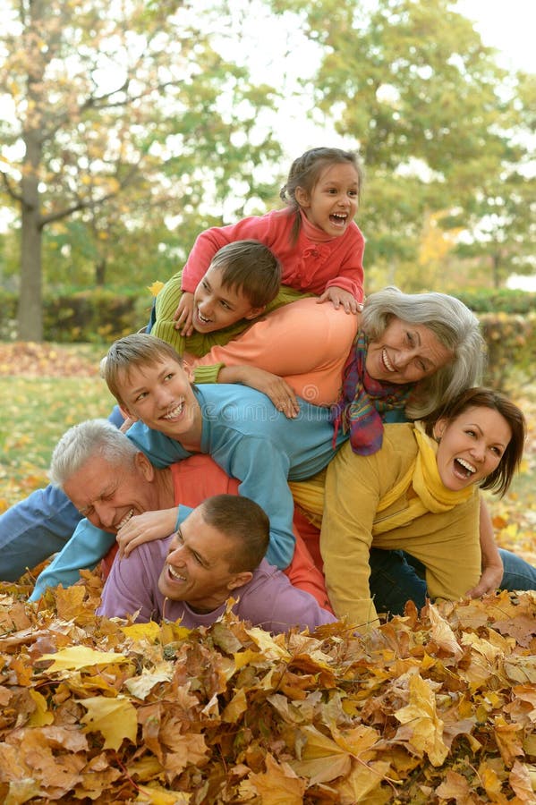 Happy family in autumn forest