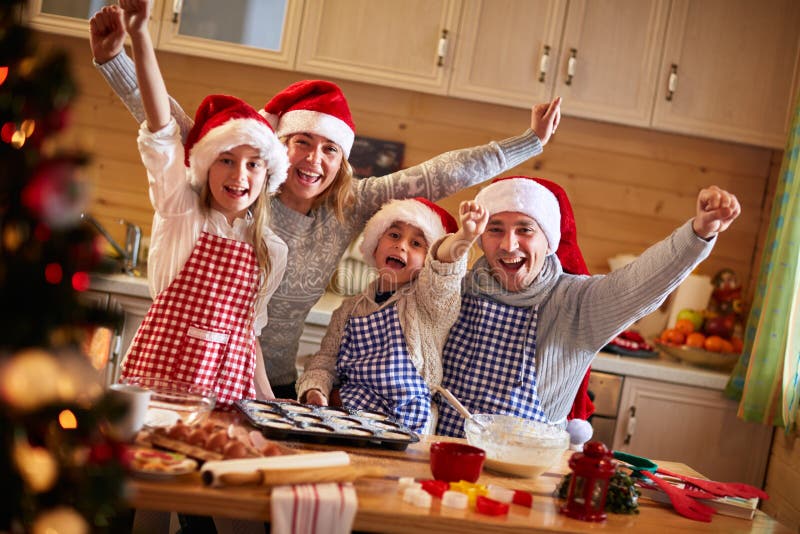 Happy family baking cookies on Christmas