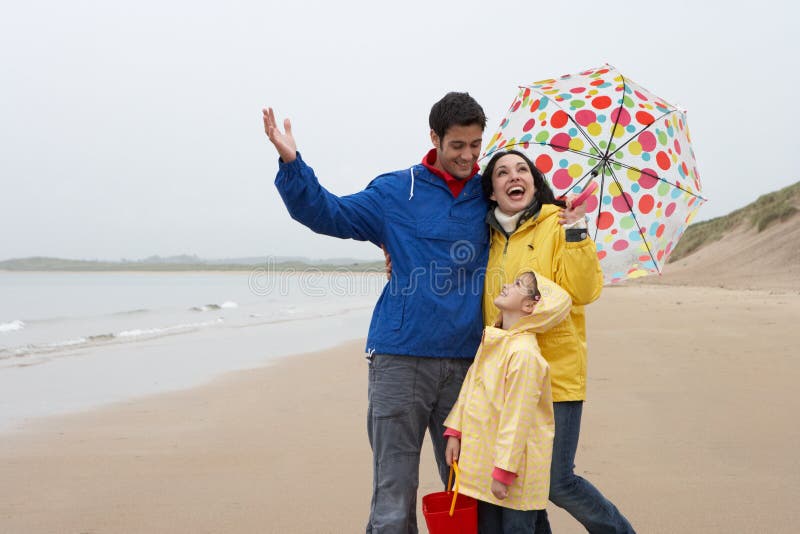 Happy Family on Beach with Umbrella Stock Image Image of posing, girl