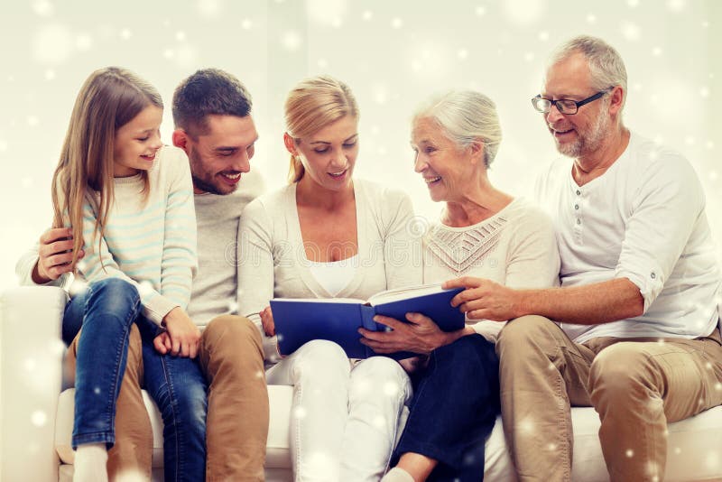 Happy family with book or photo album at home