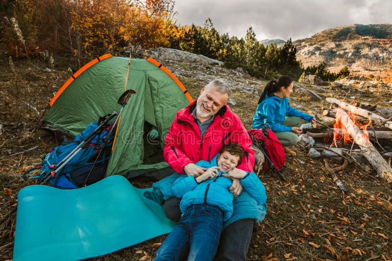 Family on a Camping Trip. Family Doing Camping in the Forest Stock