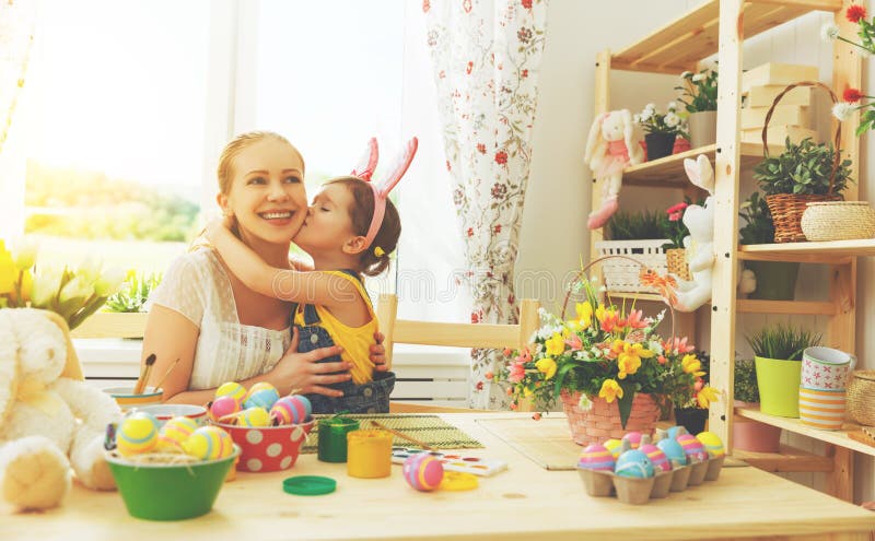 Happy family celebrating Easter. mother and daughter kissing at royalty free stock photos Happy family celebrating Easter. mother and daughter kissing at royalty free stock photos