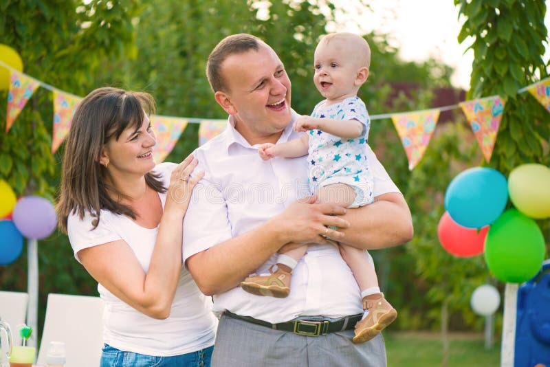 Happy family celebrating first birthday of baby royalty free stock images Happy family celebrating first birthday of baby royalty free stock images