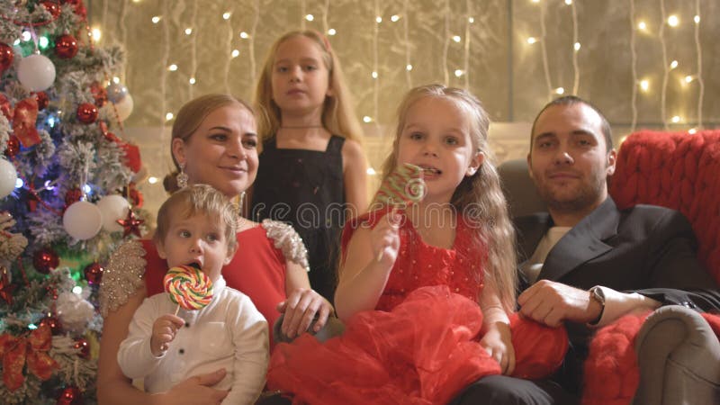 Happy family with children near the New Year tree