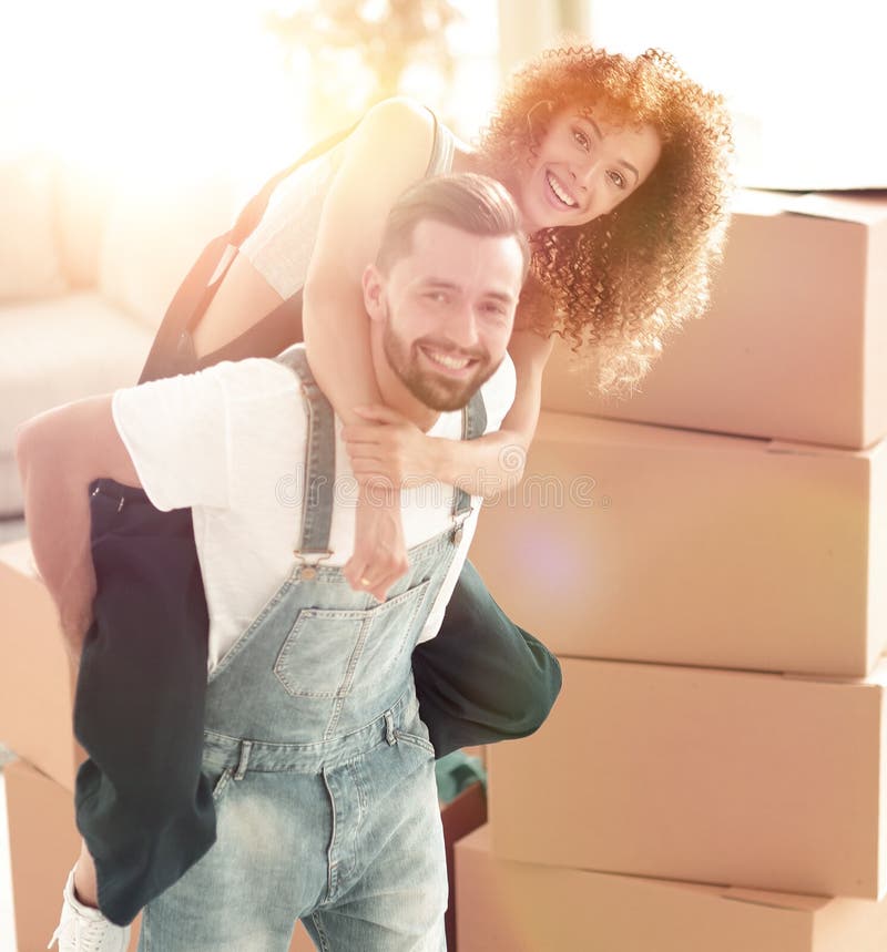 Happy family couple embracing in a new house