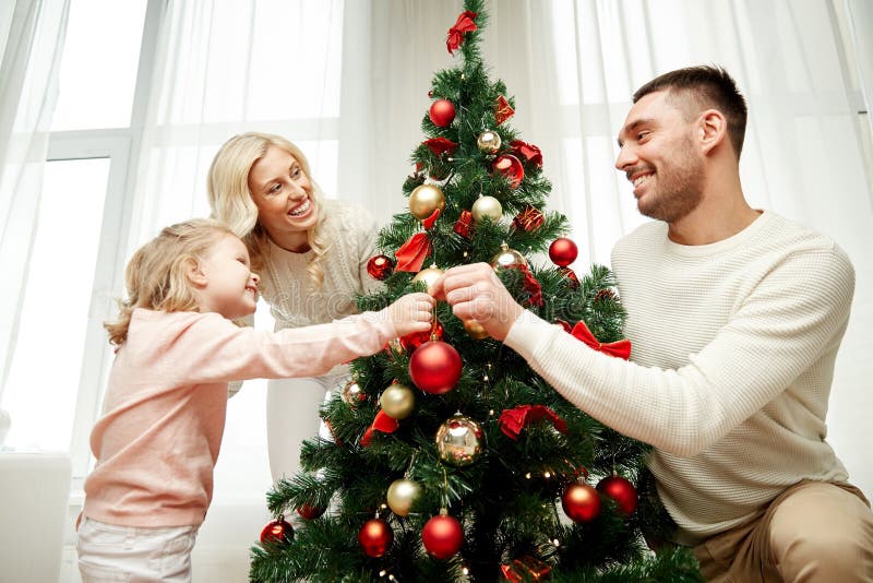 Happy Family Decorating Christmas Tree at Home Stock Photo - Image of ...