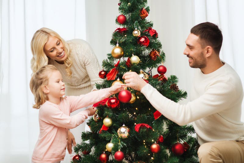 Happy Family Decorating Christmas Tree At Home Stock Photo - Image ...