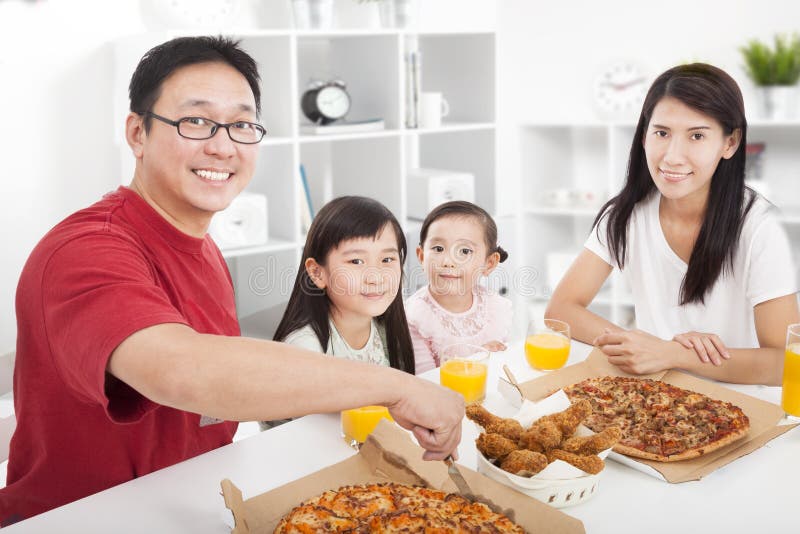 Happy Family Enjoy Their Dinner Stock Photo - Image of cheerful