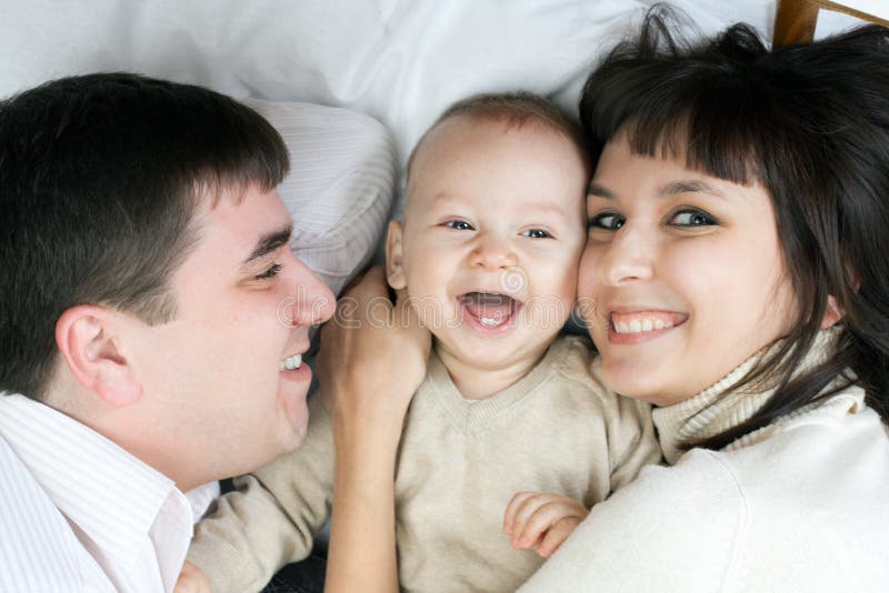 Happy family - father, mother and baby