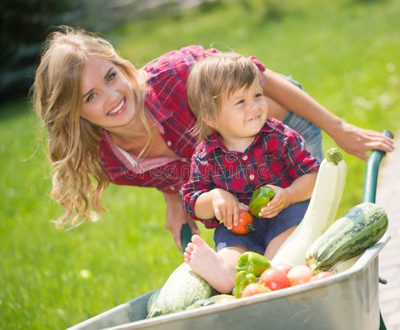 Happy family in the garden stock image. Image of green - 61159535