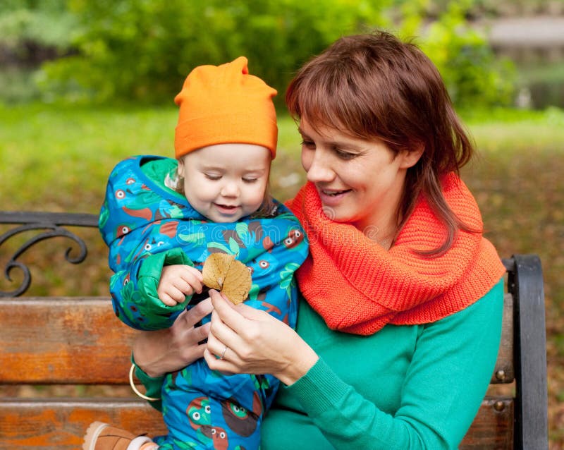 Happy family having fun in autumn park