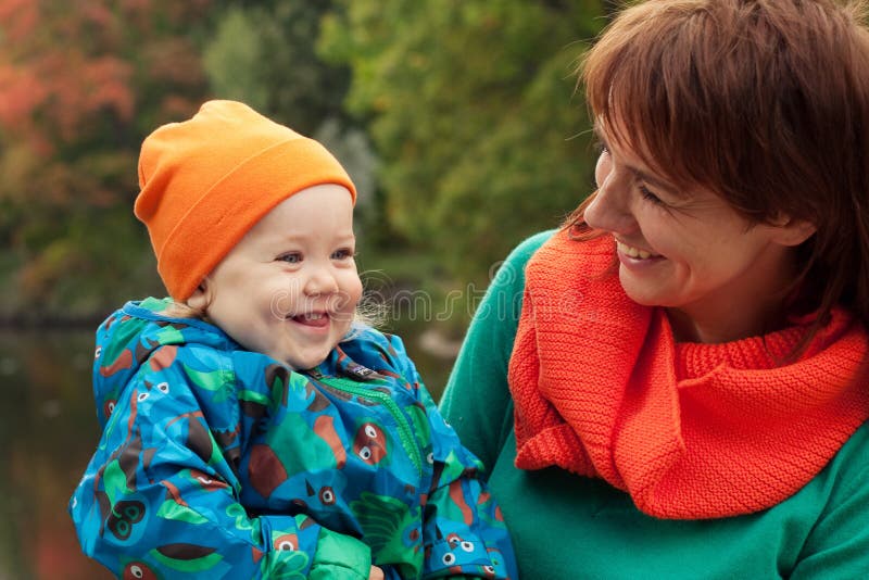 Happy family having fun in autumn park