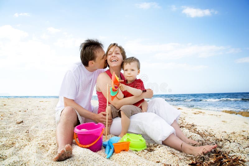 Happy family having fun on the beach. stock image Happy family having fun on the beach. stock image