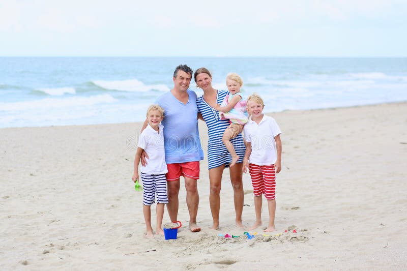 Happy Family of 5 Having Fun on the Beach Stock Photo - Image of ...