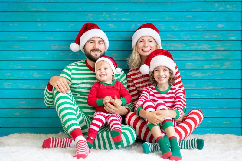 Happy family having fun at Christmas time stock images Happy family having fun at Christmas time stock images