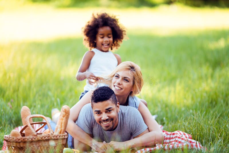 Happy family having fun time on picnic royalty free stock photography Happy family having fun time on picnic royalty free stock photography