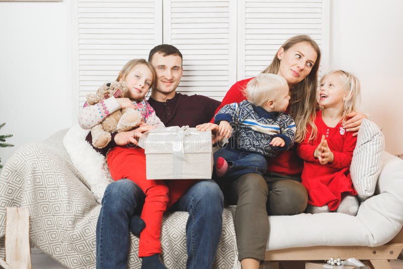 Happy family holding christmas gifts at home royalty free stock photos Happy family holding christmas gifts at home royalty free stock photos