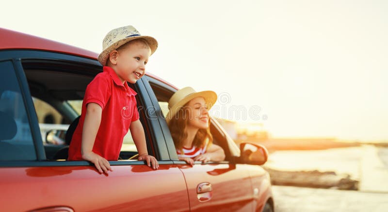 Happy  family mother and child boy goes to summer travel trip in the car