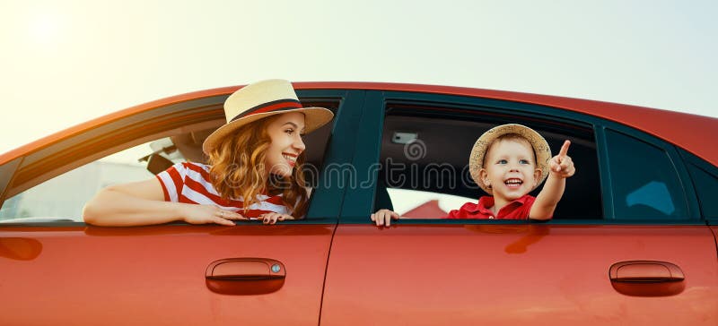 Happy  family mother and child boy goes to summer travel trip in the car