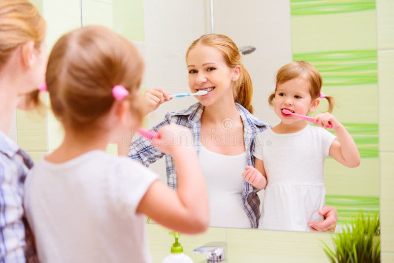 happy family mother and daughter child brushing her teeth toothbrushes royalty free stock photo happy family mother and daughter child brushing her teeth toothbrushes royalty free stock photo