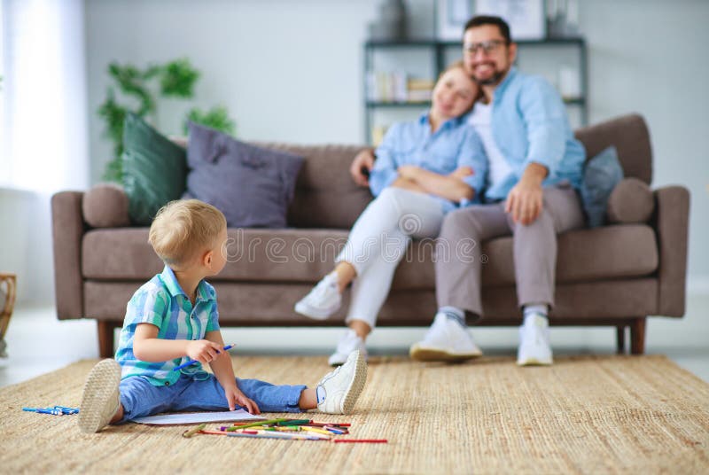 Happy family mother father and child son draw together at home royalty free stock photos Happy family mother father and child son draw together at home royalty free stock photos