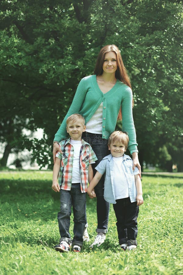 Happy family! Mother with two children sons walks on nature royalty free stock photography Happy family! Mother with two children sons walks on nature royalty free stock photography