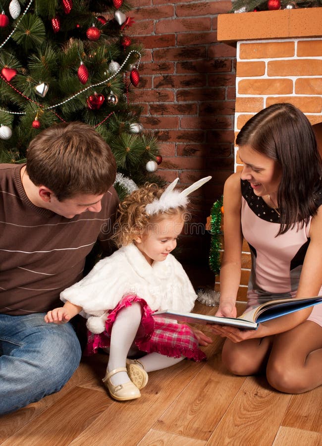 Happy family near Christmas tree