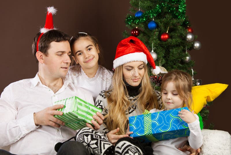 Happy Family Near the Christmas Tree Stock Photo - Image of home