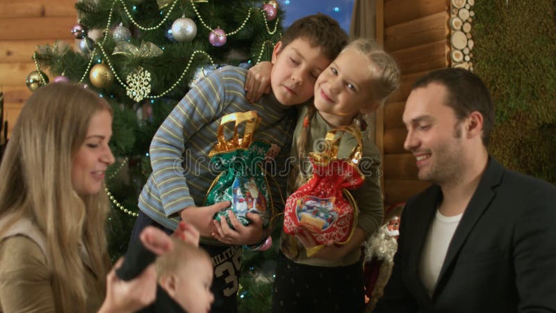 Happy family near the Christmas tree