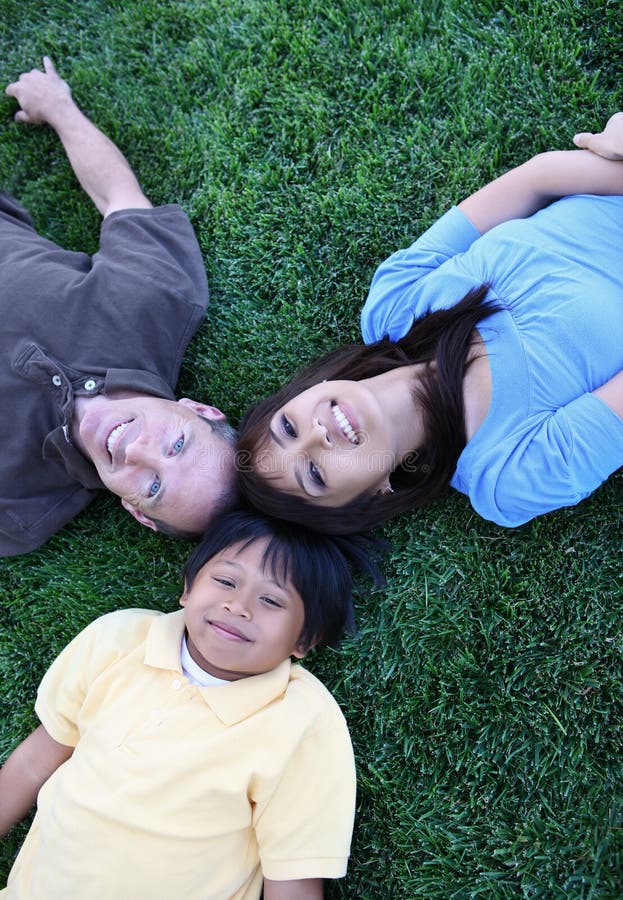 Attractive happy family having fun in the park. Attractive happy family having fun in the park