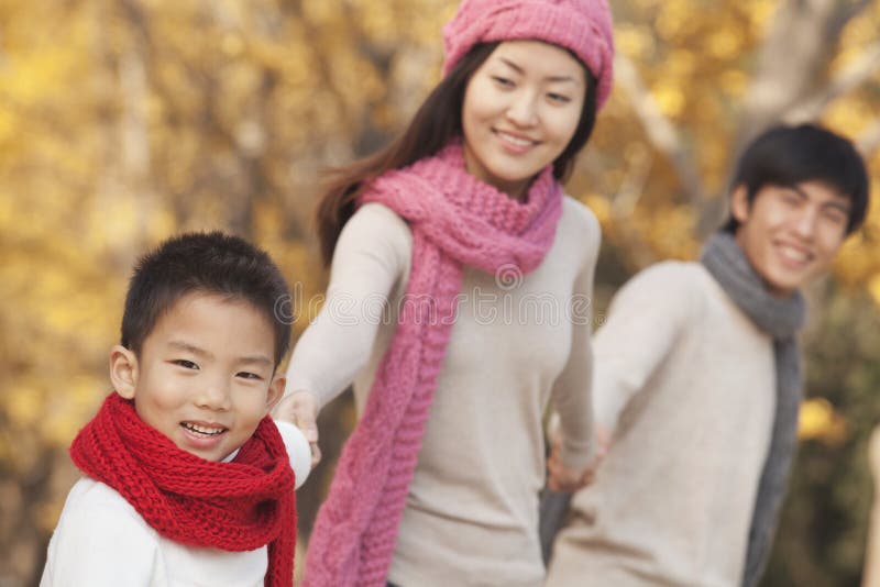 Happy Family in the Park in Autumn stock image Happy Family in the Park in Autumn stock image