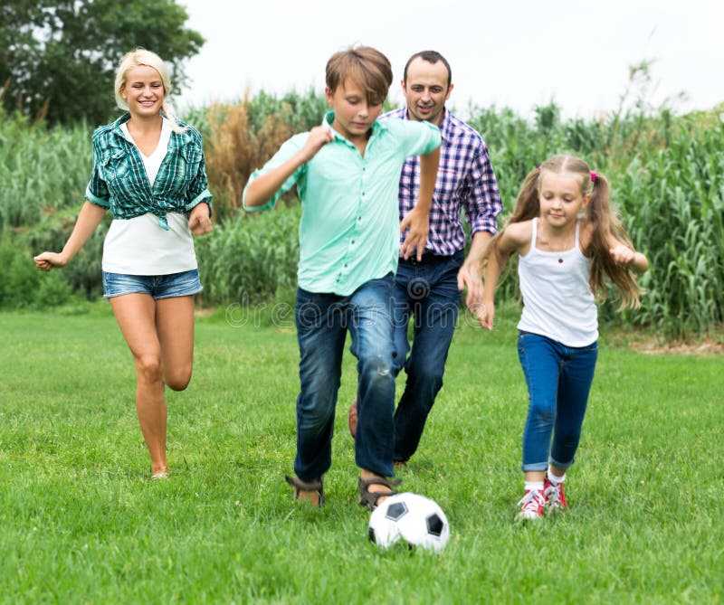 Happy family playing the ball