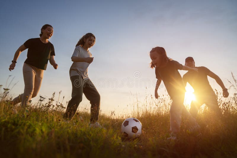 Happy Family Playing Soccer Stock Image - Image of footballer, parent:  254171433