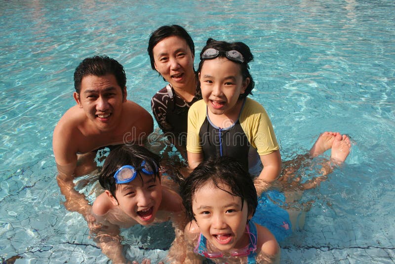 Happy family in the pool