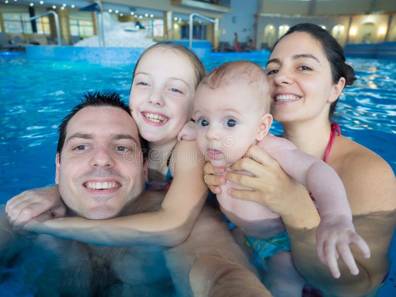 Happy family in pool