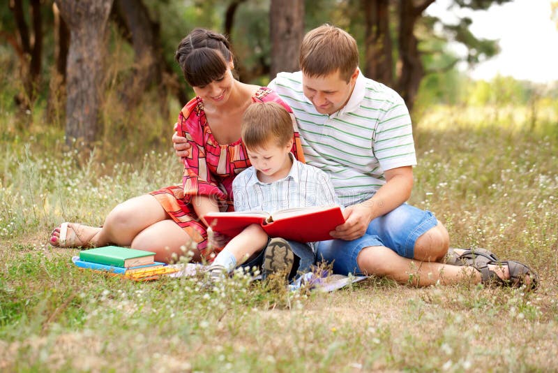 Happy family reading together. royalty free stock image