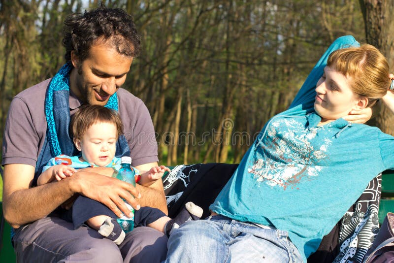 Happy family relaxing at the park