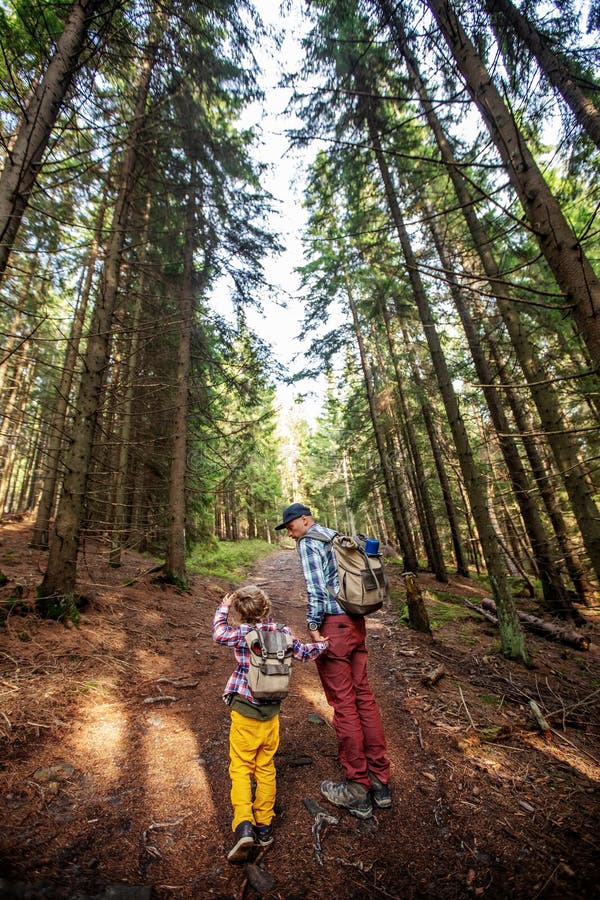 Happy family resting in the mountains in autumn royalty free stock image