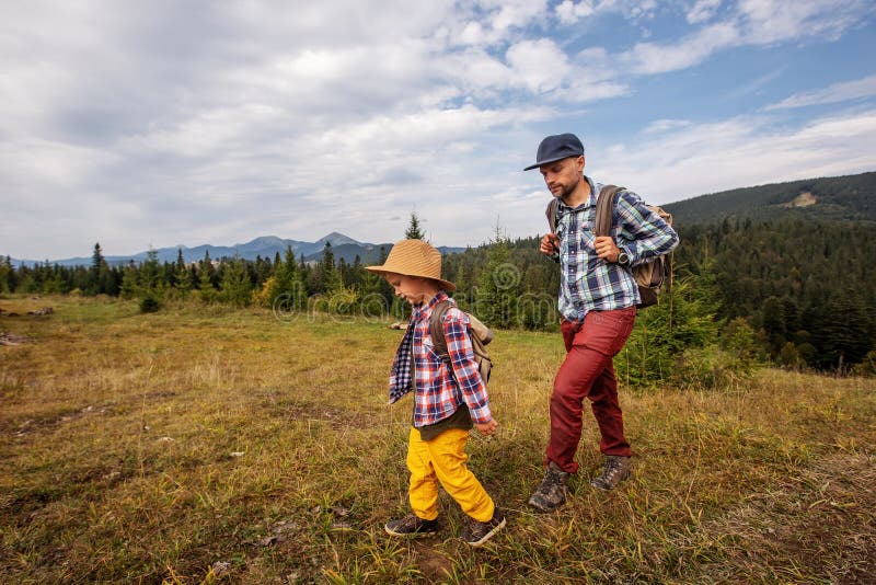 Happy family resting in the mountains in autumn royalty free stock photography